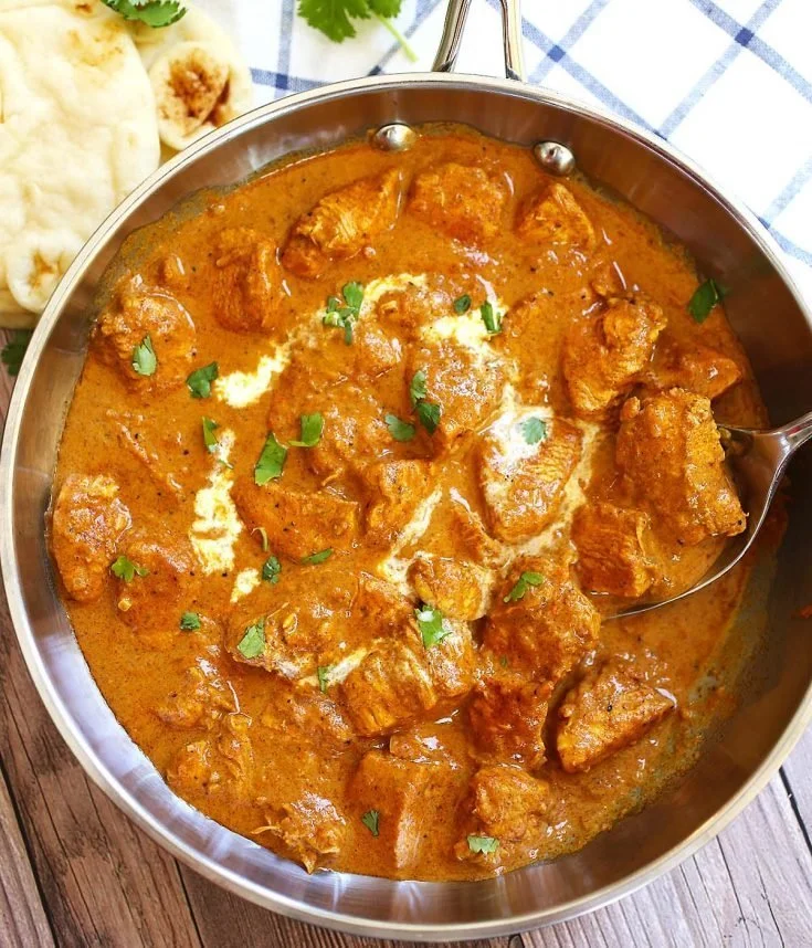 A delicious plate of easy butter chicken served with rice and naan